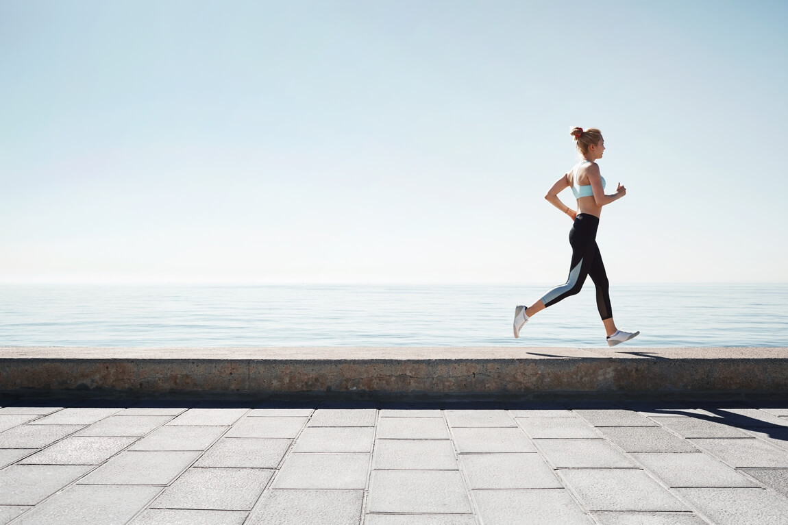 502 jogging-young-woman-running-shore