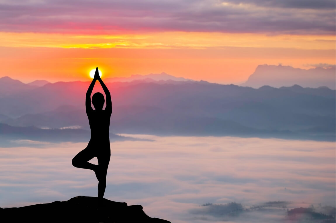 603 silhouette-woman-practicing-yoga-sunrise